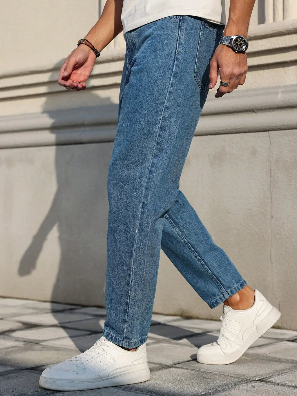 LOR MALE Men's Jeans Are Made of Classic Blue Denim Fabric with a Loose Fit, Making Them an Indispensable Versatile Item in the Wardrobe.