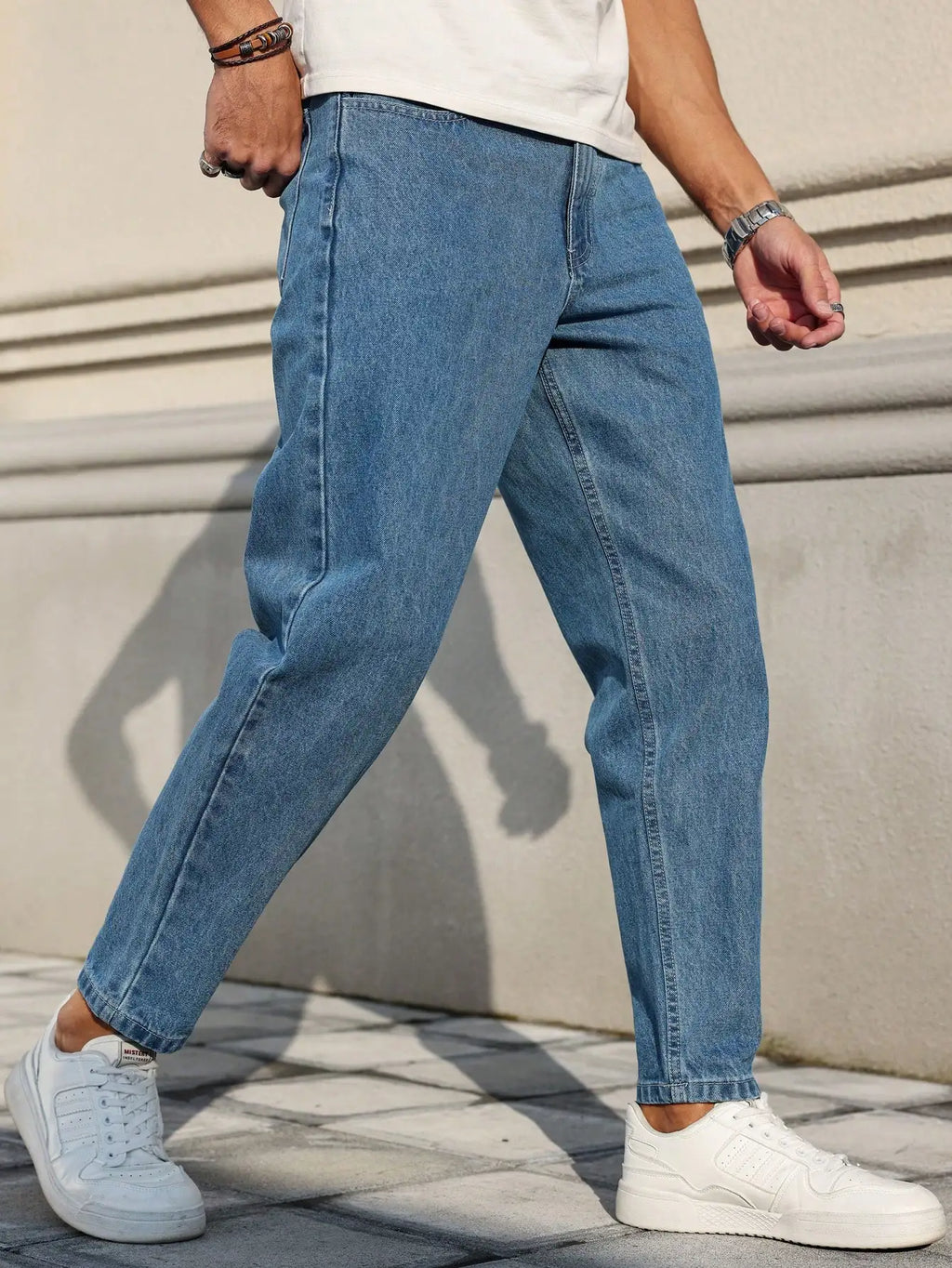 LOR MALE Men's Jeans Are Made of Classic Blue Denim Fabric with a Loose Fit, Making Them an Indispensable Versatile Item in the Wardrobe.